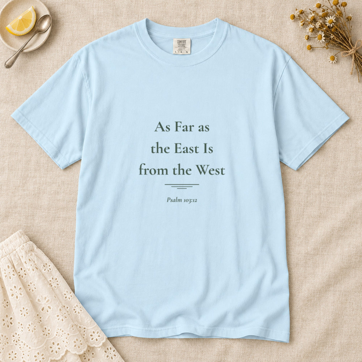 As Far as the East Is from the West Scripture tee in Chambray — flat lay