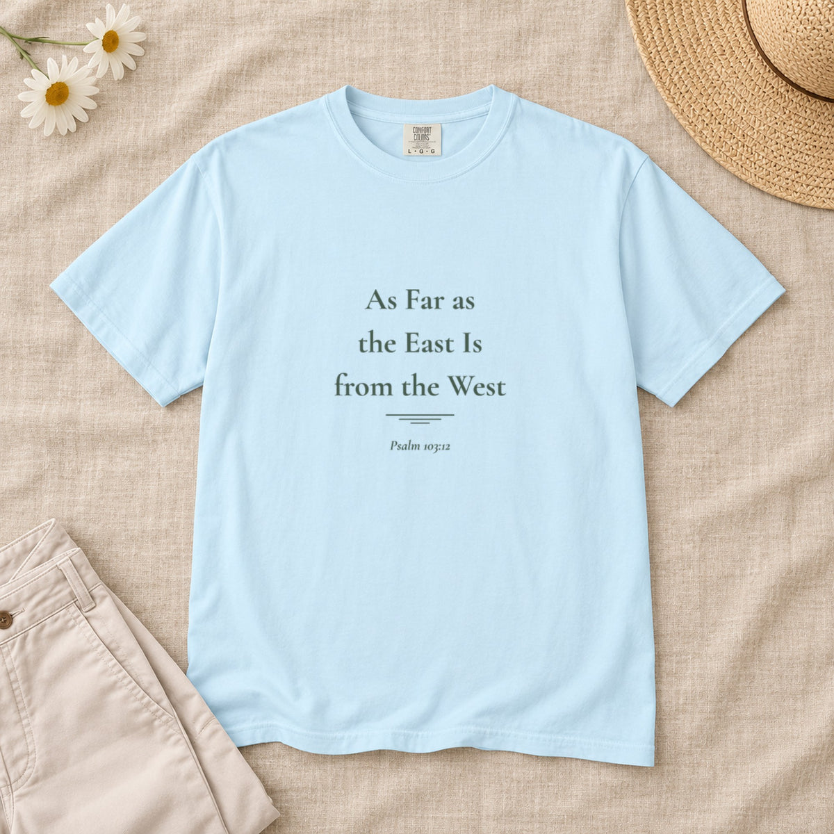 As Far as the East Is from the West Scripture tee in Chambray — styled flat lay