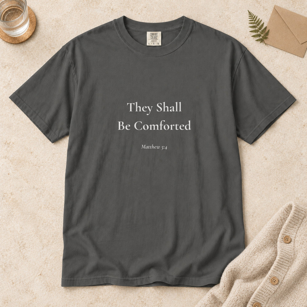 They Shall Be Comforted Scripture tee in Pepper — flat lay