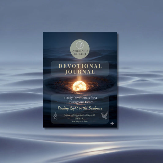 Devotional Journal Finding Light in the Darkness cover set on a bluish water-like background